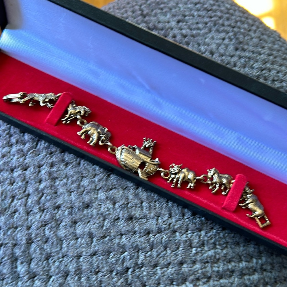 Noah’s Ark bracelet. Never worn. Bronze/gold color, approx 8.5 inches long.